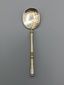 Russian-style silver and vermeil ice service with ornate spoons.