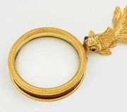 Необычное декоративное увеличительное стекло с фигурной ручкой
