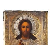 Икона, изображающая Христа с частично серебряной ризой...