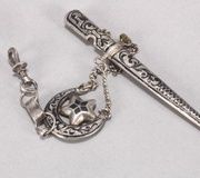 Серебряная и ниелловая брошь с кавказским кинжалом.