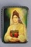 Russian beauty (boyarina) on a lacquer miniature from Fedoskino.